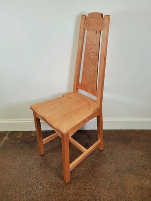 Side angle of the Hardwood Artisans Limbert chair in Cherry wood. 