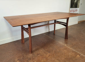 Solid wood walnut table from the Waterfall collection at Hardwood Artisans. Located near Bethesda, MD. 