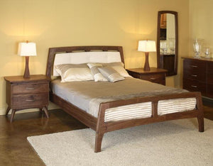 Linnaea Bed with Fabric Headboard in Walnut made by hand bedroom furniture by Hardwood Artisans available in Bristow Virginia