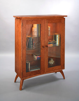 Linnaea Library is quality furniture cabinet made with real, solid hardwood, ornamental legs and 3 adjustable glass shelves