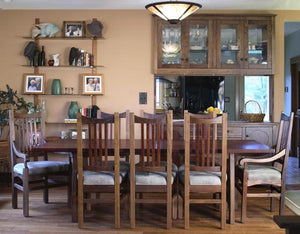 Highland Chair pictured with Arm and Side Chairs, Highland Dining Table and Custom Dining Cabinets in Walnut near Clifton