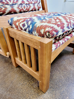 A close up of the Parlor Bungalow matching footstool made in cherry in Bethesda, MD