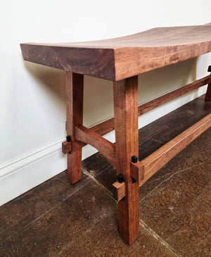 Angled picture of Japanese-inspired Double Shinto Bench in Cherry with Mahogany Wash for customers in Leesburg, VA