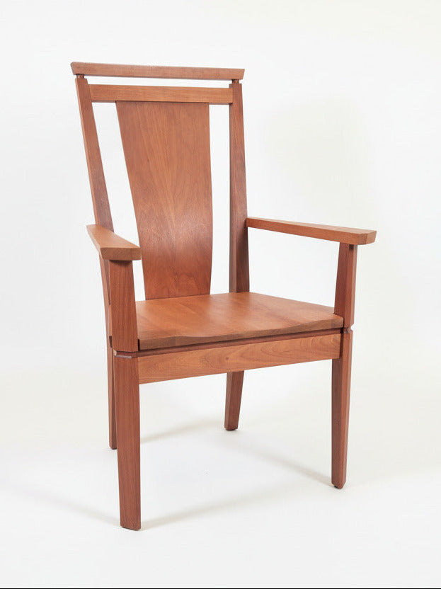 Wooden chair with a modern design on a plain background