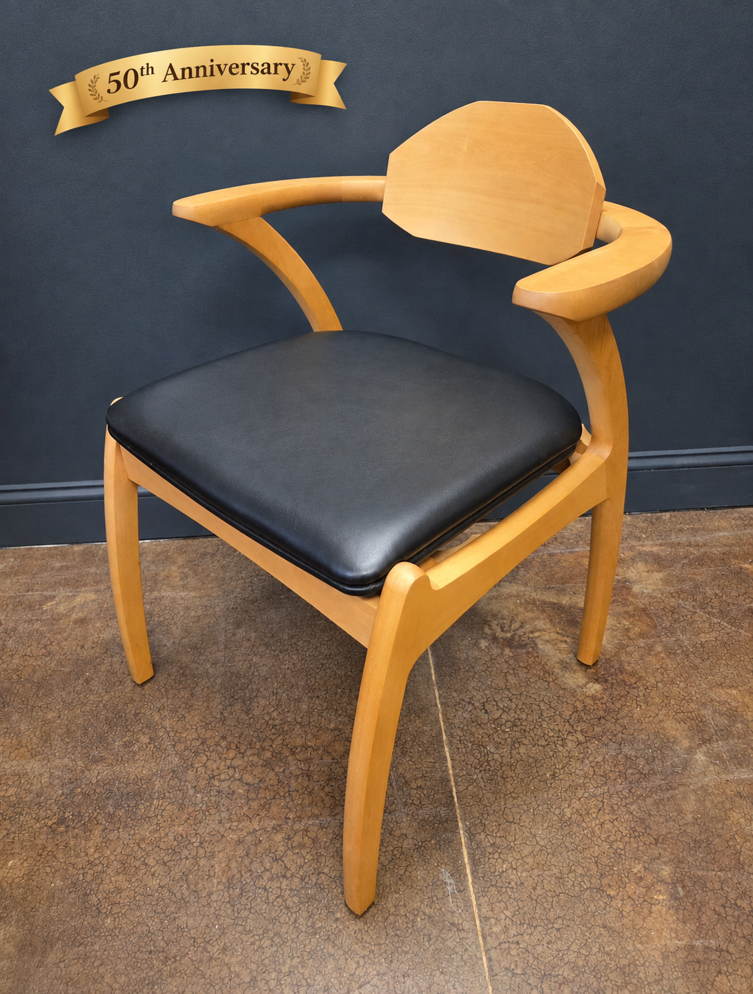 Linnaea dining arm chair in solid maple with Danish Oil finish and black leather seat in Virginia by Hardwood Artisans.