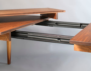 Simply Beautiful Extension Table shown in Walnut with a close up of the open extension displaying our generational quality
