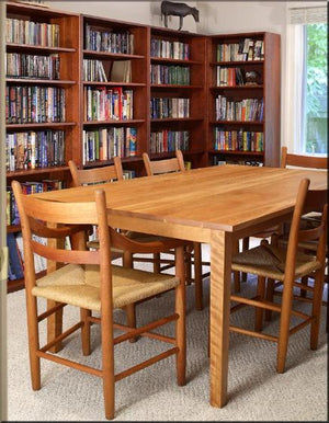 Basic Bookcase in Cherry with Mahogany Wash by Hardwood Artisans is shown with added bookcases, table & chairs for library