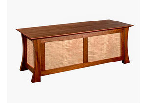 Waterfall Bench in Mahogany with Curly Maple Panels is a custom bedroom furniture chest used for storage by Hardwood Artisans