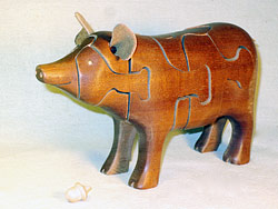 Chapman Puzzle Pig in Mahogany made at Hardwood Artisans in Elkwood, Virginia